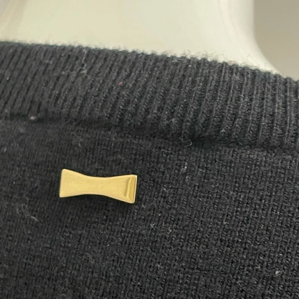 Kate spade black sweater. Looks like Front made with the unique sheep fur.